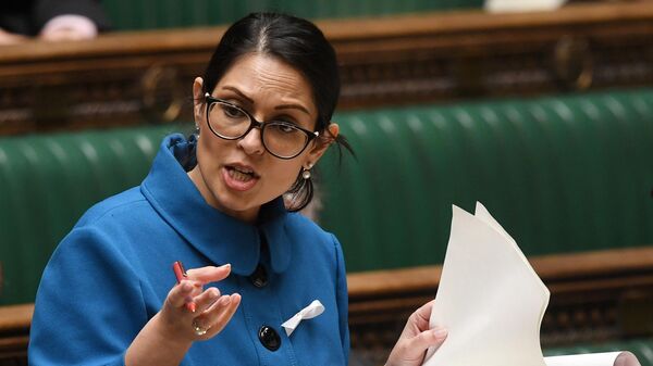A handout photograph released by the UK Parliament shows Britain's Home Secretary Priti Patel making a Statement on the 'Small boats incident in the Channel', in the House of Commons in London on November 25, 2021.  - Sputnik International