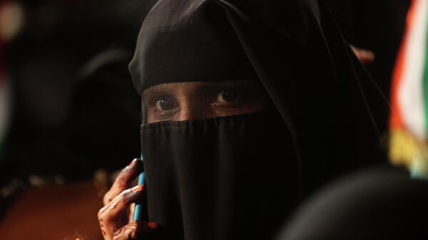 An Indian Muslim woman speaks on a phone as she participates in a protest against a new citizenship law that opponents say threatens India's secular identity, in Mumbai, India, Tuesday, Jan. 28, 2020 - Sputnik International