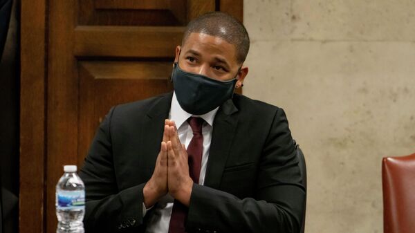 Actor Jussie Smollett listens as his grandmother Molly testifies at his sentencing hearing at the Leighton Criminal Court Building, Thursday, March 10, 2022, in Chicago. - Sputnik International