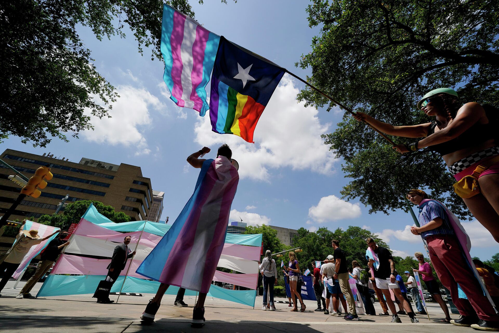 Demonstrators gather on the steps to the State Capitol to speak against transgender-related legislation bills being considered in the Texas Senate and Texas House, Thursday, May 20, 2021 in Austin, Texas. - Sputnik International, 1920, 01.09.2022