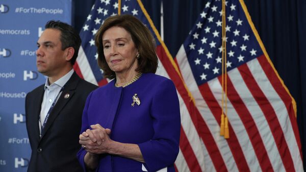 U.S. Speaker of the House Rep. Nancy Pelosi (D-CA) (R) and Rep. Pete Aguilar (D-CA) (L) listen during a news conference at the 2022 House Democratic Caucus Issues Conference March 11, 2022 in Philadelphia, Pennsylvania. - Sputnik International