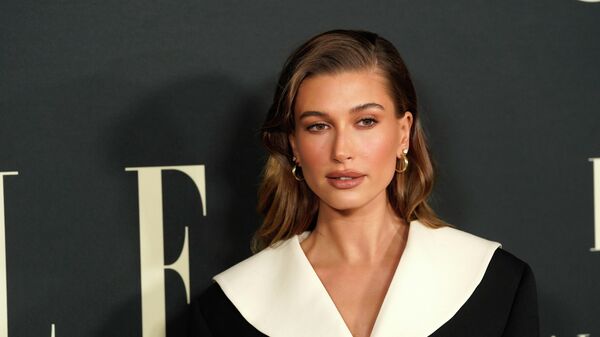 FILE - Hailey Bieber arrives at the 27th annual ELLE Women in Hollywood celebration on Tuesday, Oct. 19, 2021, at the Academy Museum of Motion Pictures in Los Angeles. The model says on Saturday, March 12, 2022, that she's fine after a health scare, suffering a small blood clot to her brain. Bieber, wife of pop star Justin Bieber, posted on Instagram Saturday that she was having breakfast with her husband on Thursday when she began feeling stroke-like symptoms. - Sputnik International
