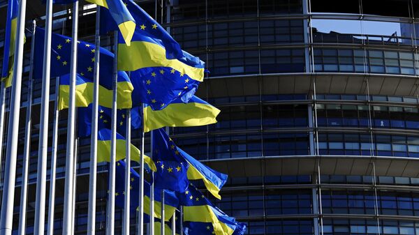 A picture taken on March 8, 2022 shows European Union's and Ukrainian flags fluttering outside the European Parliament in Strasbourg, eastern France. - Sputnik International