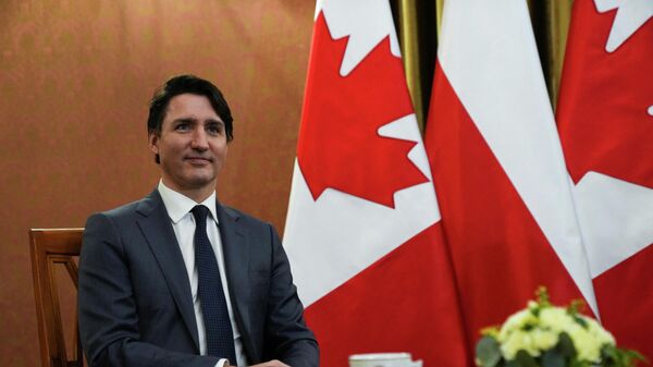 Canadian Prime Minister Justin Trudeau sits as he meets Polish Prime Minister Mateusz Morawiecki, amid Russia's invasion of Ukraine, in Warsaw, Poland, March 10, 2022 - Sputnik International