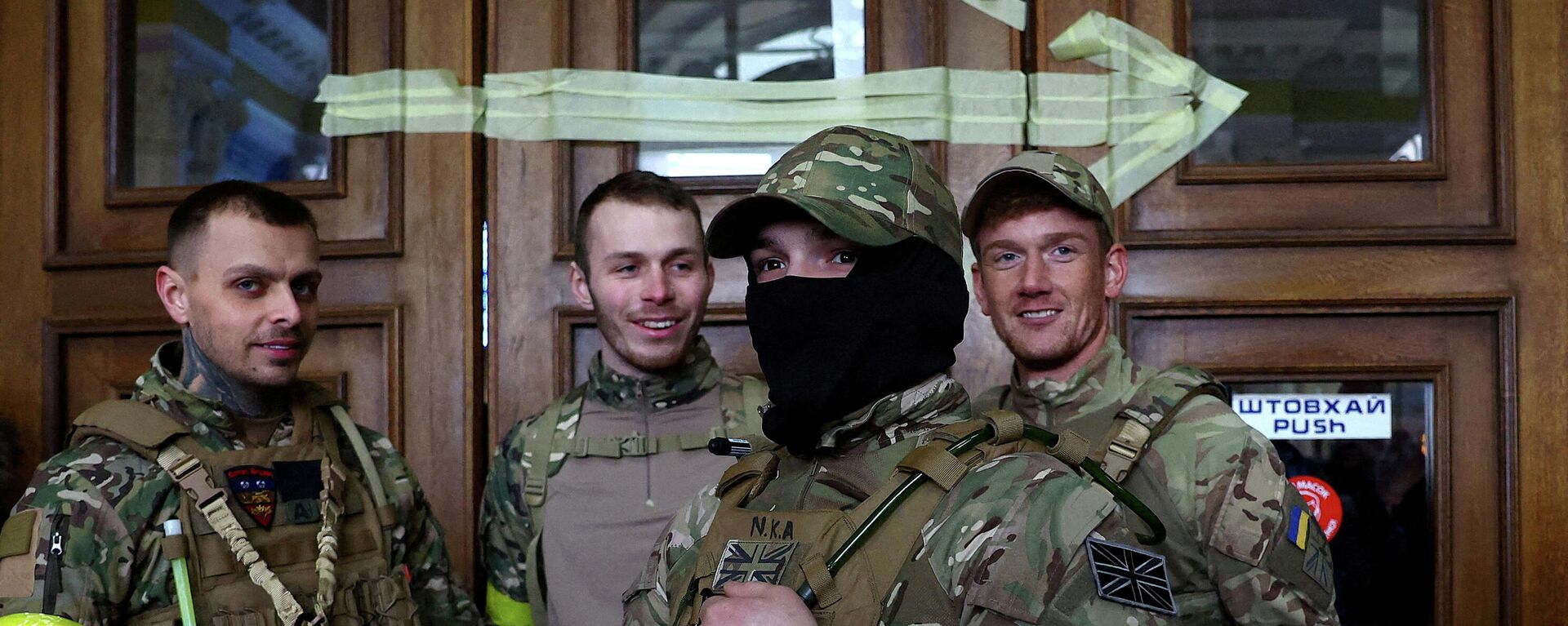 FILE PHOTO: Four foreign fighters from the UK pose for a picture prior to their departure towards the front line in the east of Ukraine following the Russian military operation, at the main train station in Lviv, Ukraine, March 5, 2022. Picture taken March 5, 2022 - Sputnik International, 1920, 31.03.2022