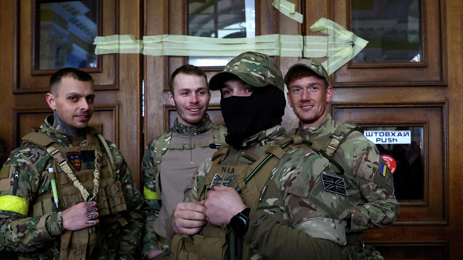 FILE PHOTO: Four foreign fighters from the UK pose for a picture prior to their departure towards the front line in the east of Ukraine following the Russian military operation, at the main train station in Lviv, Ukraine, March 5, 2022. Picture taken March 5, 2022 - Sputnik International, 1920, 31.03.2022
