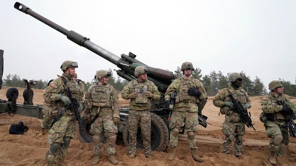 U.S. troops stand during military drills at Adazi Military base in Kadaga, Latvia, Tuesday, March. 8, 2022 - Sputnik International