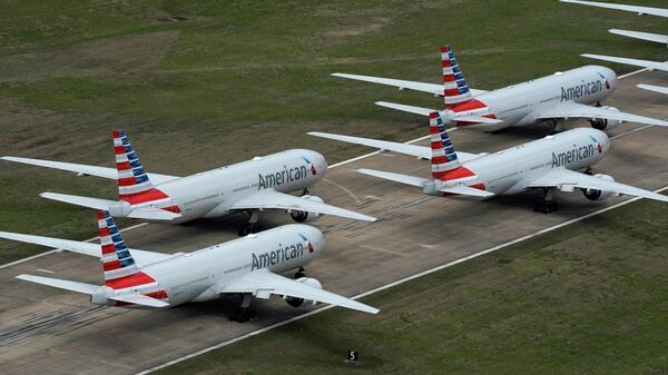 American Airlines passenger planes crowd a runway where they are parked due to flight reductions to slow the spread of coronavirus disease (COVID-19), at Tulsa International Airport in Tulsa, Oklahoma, U.S. March 23, 2020. - Sputnik International