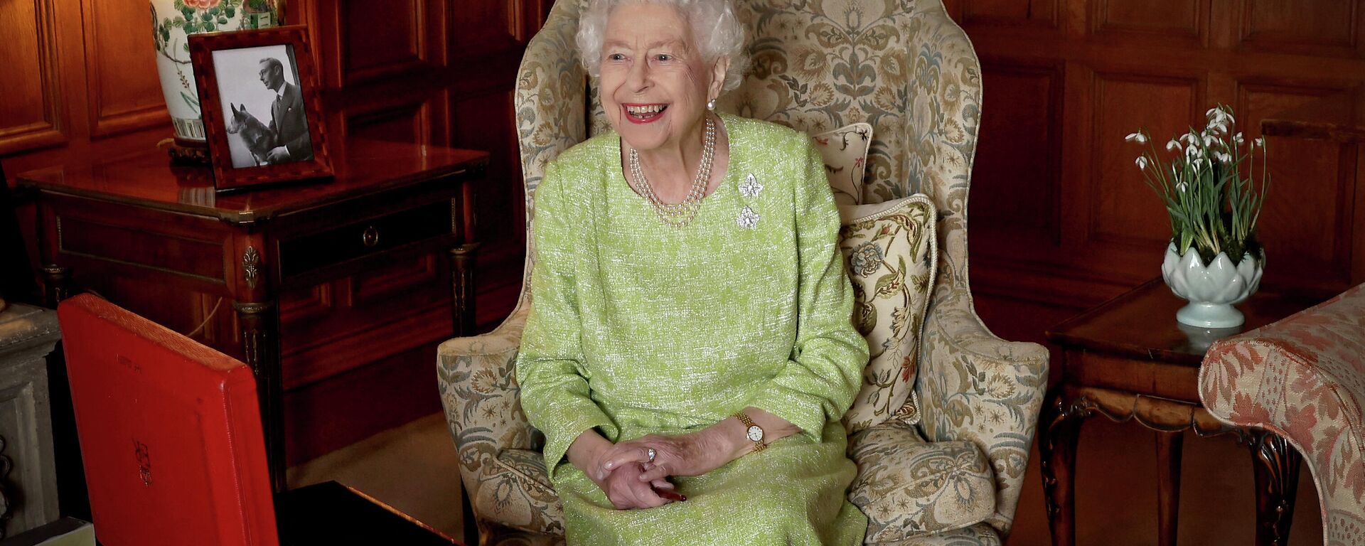 A file Buckingham Palace handout image released on February 6, 2022, shows Britain's Queen Elizabeth II smiling as she sits in Sandringham House in Norfolk, eastern England on February 2, 2022 - Sputnik International, 1920, 17.04.2022