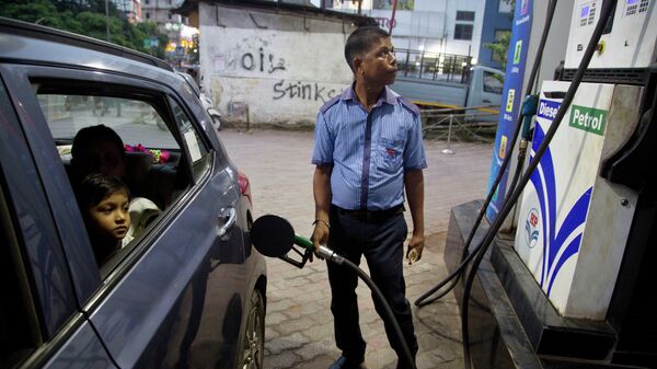 FILE - A man fills his car at a gasoline station in Gauhati, India, Sunday, Sept. 22, 2019 - Sputnik International