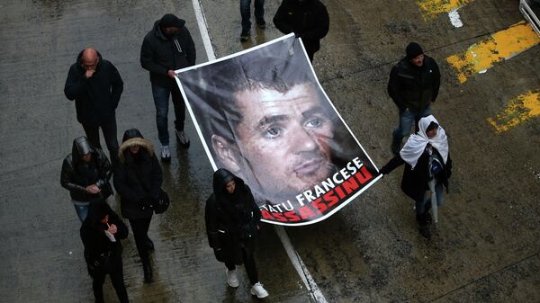 (FILES) In this file photo taken on March 13, 2022 in Bastia, protesters hold a portrait of Yvan Colonna during a rally to pay tribute to the pro-independence activist after he was assaulted in the prison of Arles - Sputnik International