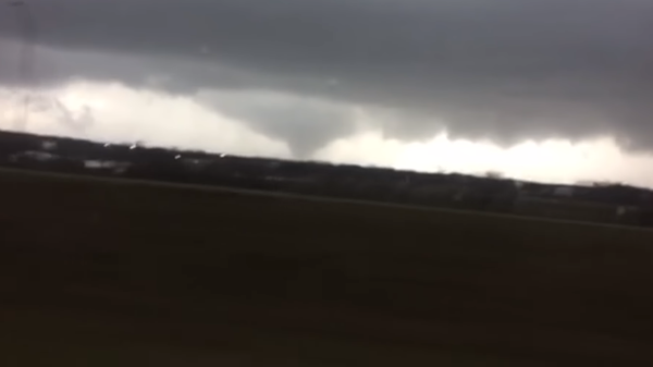 Footage shot from a moving car of one of nine tornadoes that struck Texas on March 21, 2022. - Sputnik International