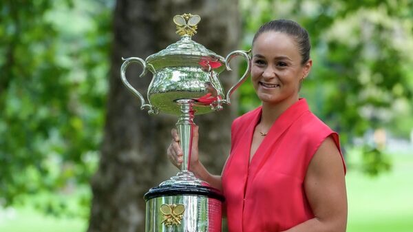 FILE - Ash Barty of Australia poses with the Daphne Akhurst Memorial Cup at a park, the morning after defeating Danielle Collins of the U.S. in the women's singles final at the Australian Open tennis championships in Melbourne on Jan. 30, 2022. In a shock announcement Wednesday, March 23, 2022, No. 1-ranked Barty announced her retirement from tennis - Sputnik International
