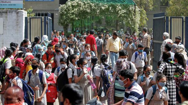 Students leave school after a majority of schools were reopened following their closure due to the coronavirus disease (COVID-19) pandemic, in Ahmedabad, India, February 24, 2022. Picture taken February 24, 2022 - Sputnik International