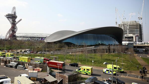 Emergency crews and vehicles are pictured outside the Queen Elizabeth Olympic Park following a leak of noxious fumes, in London, Britain March 23, 2022 - Sputnik International