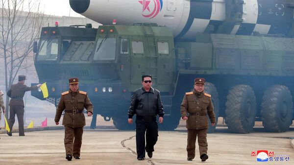 North Korean leader Kim Jong Un walks away from what state media report is a new type of intercontinental ballistic missile (ICBM) in this undated photo released on March 24, 2022 by North Korea's Korean Central News Agency (KCNA).  - Sputnik International