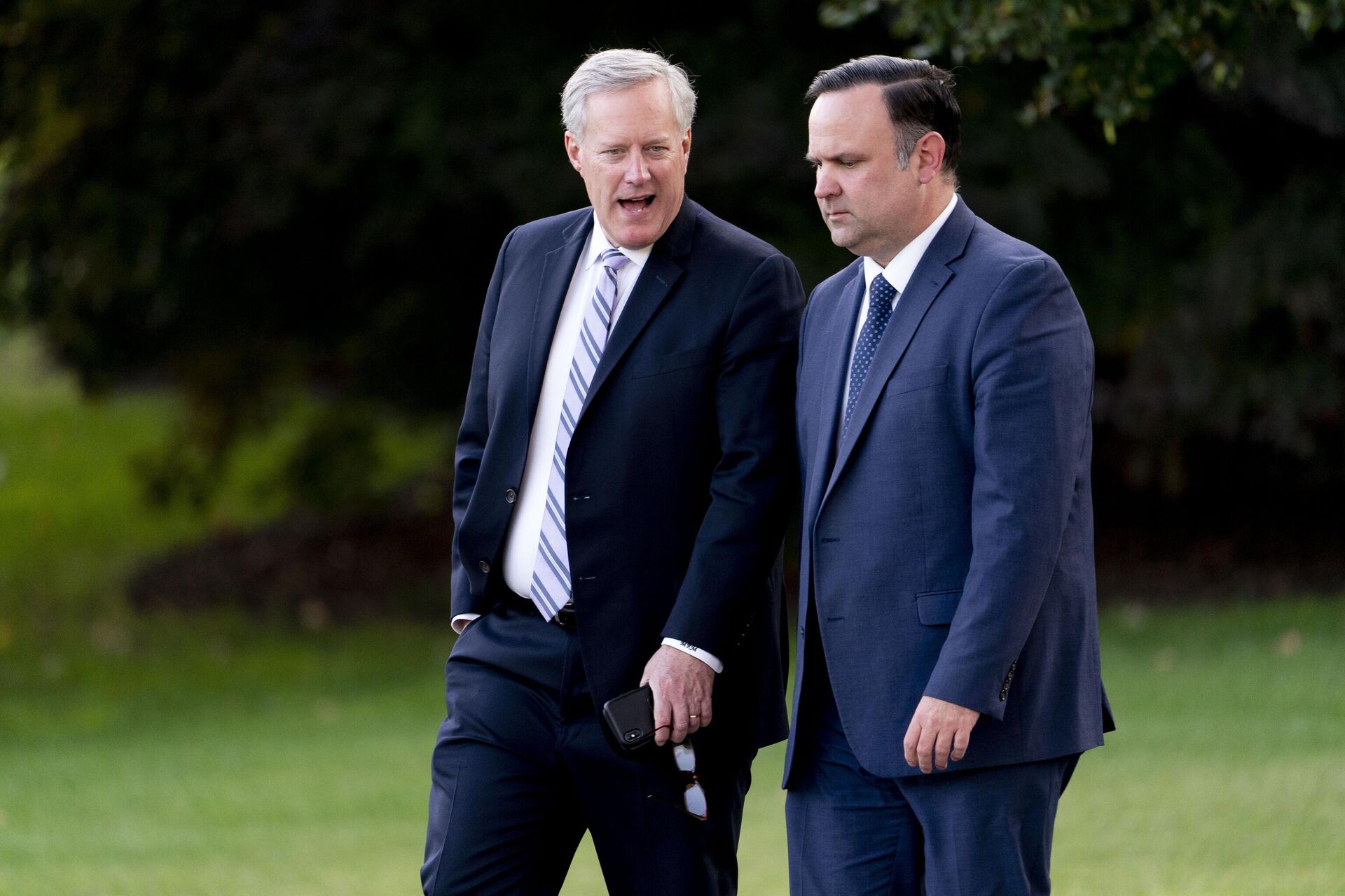 White House social media director Dan Scavino, right, and White House chief of staff Mark Meadows, left, walk to board Marine One with President Donald Trump on the South Lawn of the White House, Tuesday, Sept. 22, 2020, before leaving for a short trip to Andrews Air Force Base, Md., and then onto Pittsburgh for a campaign rally.  - Sputnik International, 1920, 25.03.2022