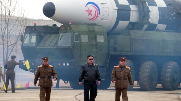 North Korean leader Kim Jong Un walks away from what state media report is a new type of intercontinental ballistic missile (ICBM) in this undated photo released on March 24, 2022 by North Korea's Korean Central News Agency (KCNA).  - Sputnik International