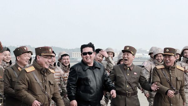 North Korean leader Kim Jong Un (C) walking with North Korean military personnel during the test launch operation of what state media reports a new type inter-continental ballistic missile (ICBM), the Hwasongpho-17. - Sputnik International