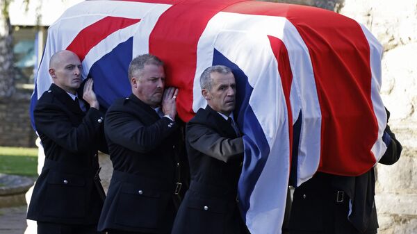 Pallbearers carry the coffin of Conservative MP, David Amess, out from St Mary's Church in Prittlewell, Southend-on-Sea on November 22, 2021, after his funeral service. - Sputnik International