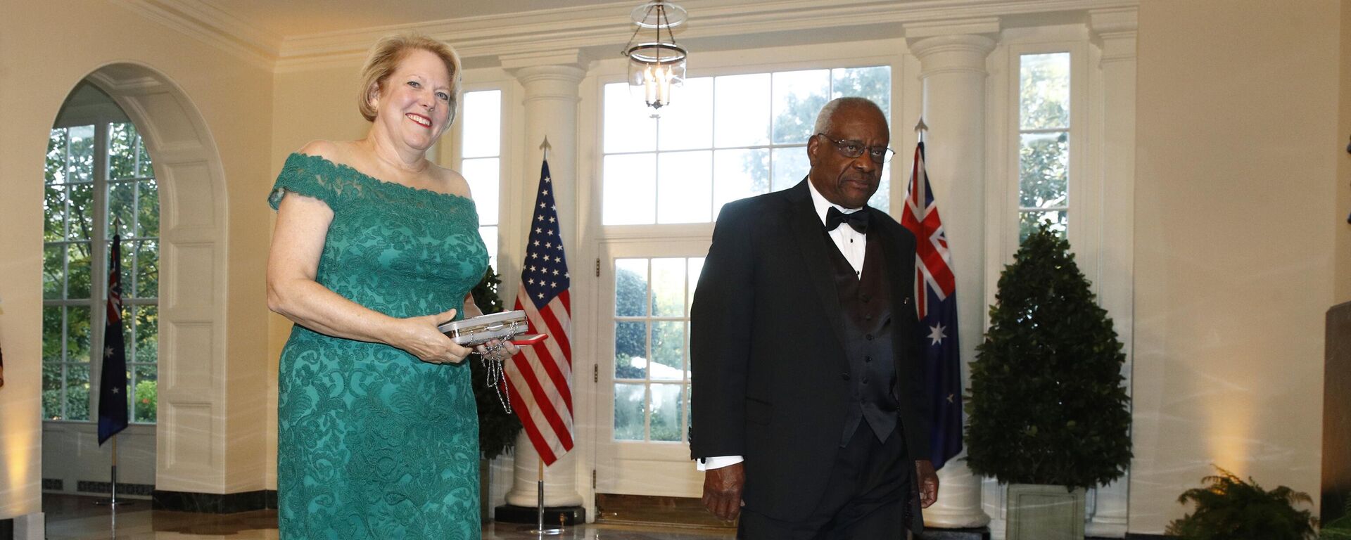 In this Sept. 20, 2019, file photo, Supreme Court Associate Justice Clarence Thomas, right, and wife Virginia Ginni Thomas arrive for a State Dinner with Australian Prime Minister Scott Morrison and President Donald Trump at the White House in Washington. Ginni Thomas is using her Facebook page to amplify unsubstantiated claims of corruption by Joe Biden. She is a longtime conservative activist who asked her more than 10,000 followers Oct. 26, 2020, to consider sharing a link focused on alleged corruption by Biden and his son, Hunter, as well as claims that social media companies are censoring reports about the Bidens. - Sputnik International, 1920, 25.03.2022
