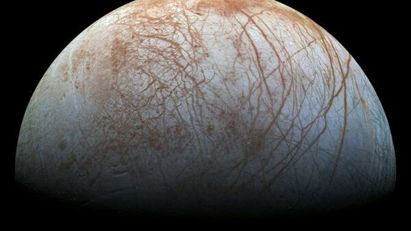 The puzzling, fascinating surface of Jupiter's icy moon Europa looms large in this newly-reprocessed color view, made from images taken by NASA's Galileo spacecraft in the late 1990s. This is the color view of Europa from Galileo that shows the largest portion of the moon's surface at the highest resolution. - Sputnik International