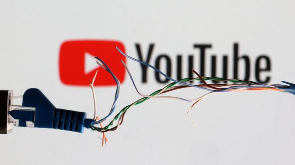 Broken Ethernet cable is seen in front of Youtube logo in this illustration taken March 11, 2022.  - Sputnik International