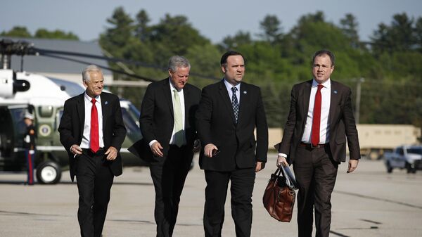 White House trade adviser Peter Navarro, from left, White House chief of staff Mark Meadows, White House social media director Dan Scavino and White House staff secretary Derek Lyons follow President Donald Trump aboard Air Force One at Bangor International Airport in Bangor, Maine, Friday, June 5, 2020, en route to Andrews Air Force Base, Md., after attending a roundtable discussion with commercial fishermen and touring a medical swab manufacturing facility. (AP Photo/Patrick Semansky) - Sputnik International