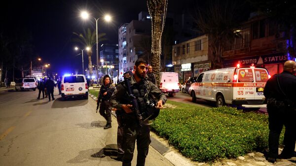Israeli border police secure the area at the scene of an attack in which people were killed by gunmen on a main street in Hadera, Israel, March 27, 2022.  - Sputnik International