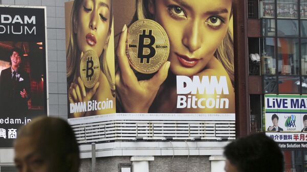 A huge advertisement of Bitcon is displayed near a train station in Tokyo Monday, Jan. 29, 2018 - Sputnik International