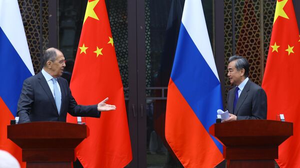 Russian Foreign Minister Sergey Lavrov and Chinese Foreign Minister Wang Yi, 23 March 2022, China - Sputnik International