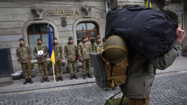 A foreign fighter walks past an honour guard . Lviv, Ukraine, March 16, 2022 - Sputnik International