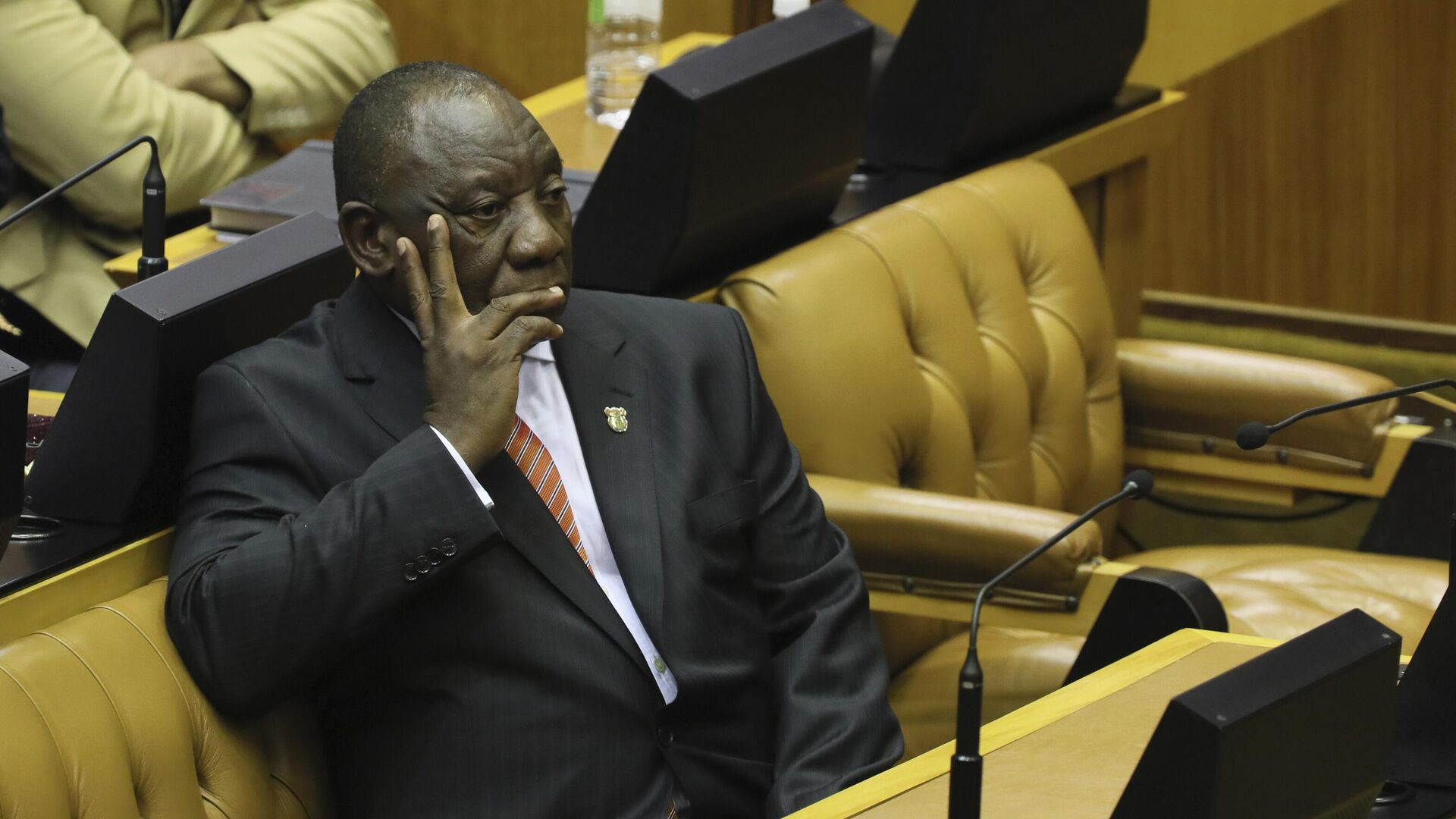 South African President Cyril Ramaphosa waits as members of the Economic Freedom Fighters (EFF) party disrupt parliament proceedings at the State of the Nation Address in Cape Town, South Africa, Thursday, Feb. 13, 2020. - Sputnik International, 1920, 30.03.2022