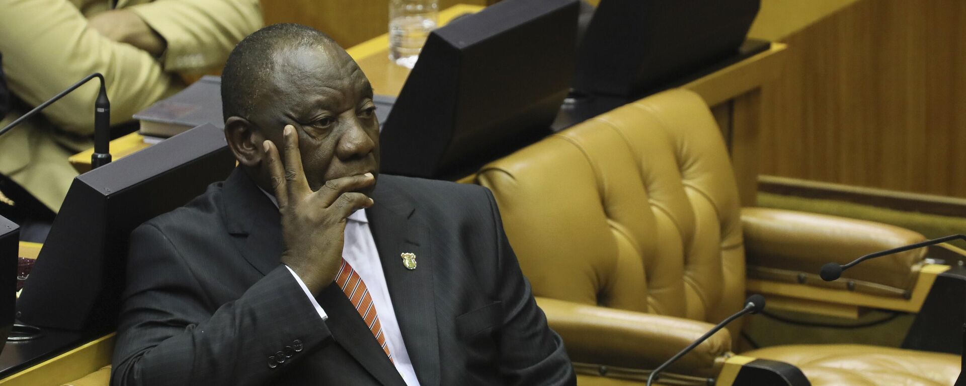 South African President Cyril Ramaphosa waits as members of the Economic Freedom Fighters (EFF) party disrupt parliament proceedings at the State of the Nation Address in Cape Town, South Africa, Thursday, Feb. 13, 2020. - Sputnik International, 1920, 07.06.2022