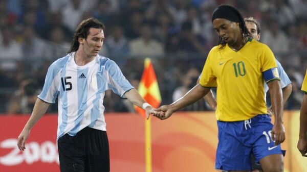 Argentina's Lionel Messi, left, and Brazil's Ronaldinho shake hands during their men's semifinal soccer match at the Beijing 2008 Olympics in Beijing, Tuesday, Aug. 19, 2008 - Sputnik International