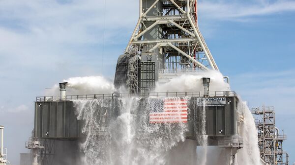 About 450,000 gallons of water poured onto the Pad B flame deflector, the mobile launcher flame hole and onto the launcher’s blast deck during NASA's water flow test on September 13, 2019.  - Sputnik International