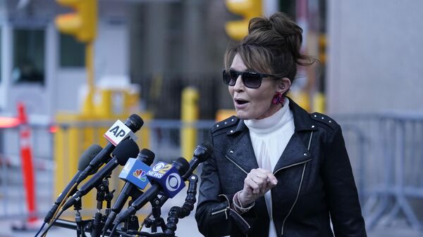 Former Alaska Gov. Sarah Palin speaks briefly to reporters as she leaves a courthouse in New York, Monday, Feb. 14, 2022. A judge said Monday he’ll dismiss a libel lawsuit that Palin filed against The New York Times, claiming the newspaper damaged her reputation with an editorial falsely linking her campaign rhetoric to a mass shooting. U.S. District Judge Jed Rakoff made the ruling with a jury still deliberating at the trial where the former Alaska governor and vice-presidential candidate testified last week. - Sputnik International