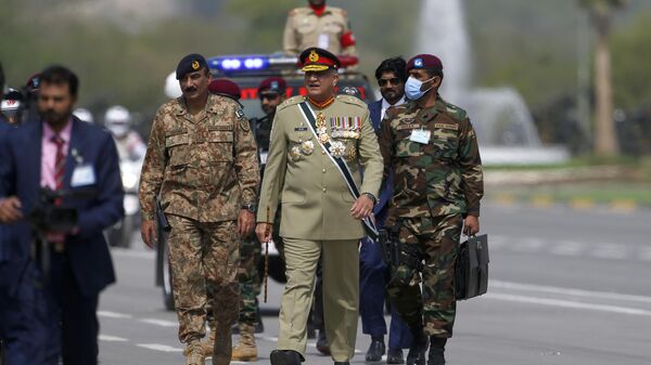 Pakistan's Army Chief General Qamar Javed Bajwa attends a military parade to mark Pakistan National Day in Islamabad, Pakistan, Wednesday, March 23, 2022.  - Sputnik International