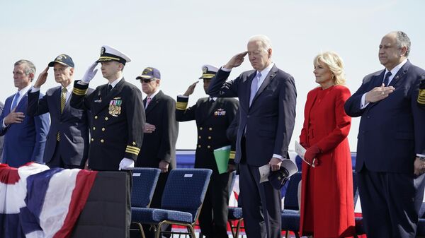 President Joe Biden, first lady Jill Biden and United States Secretary of the Navy Carlos Del Toro, stand during a 21-cannon salute at a commissioning ceremony for USS Delaware, Virginia-class fast-attack submarine, at the Port of Wilmington in Wilmington, Del., Saturday, April 2, 2022.  - Sputnik International