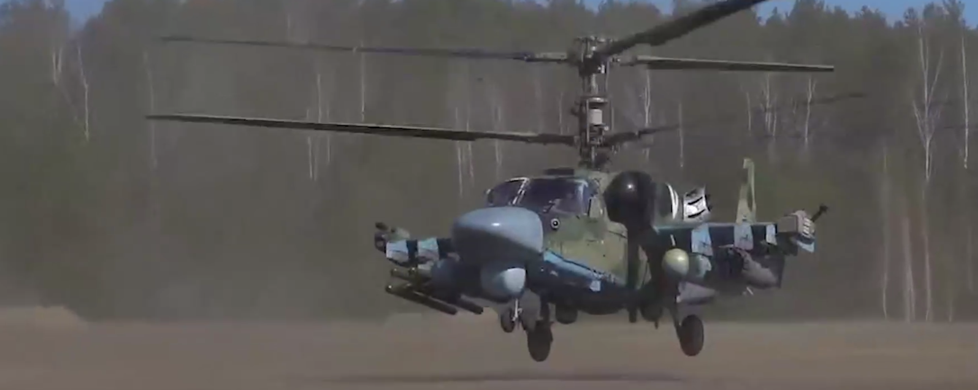 A screenshot of a video depicting a Ka-52 attack helicopter hitting Ukrainian positions. - Sputnik International, 1920, 03.04.2022