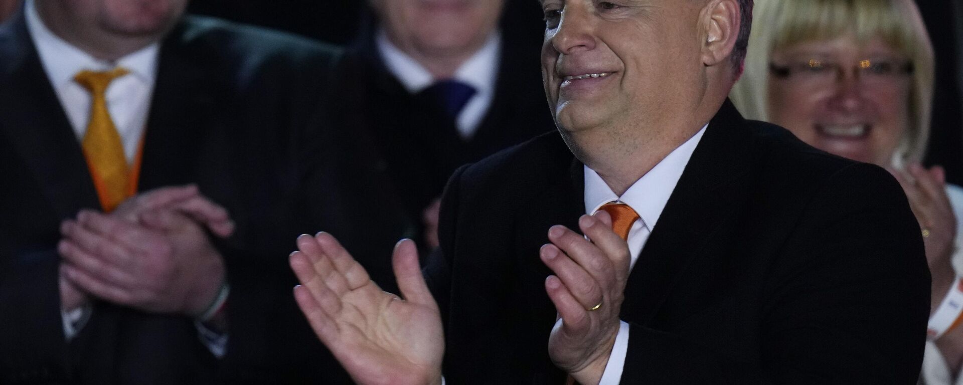 Hungary's Prime Minister Viktor Orban acknowledges cheering supporters during an election night rally in Budapest, Hungary, Sunday, April 3, 2022. Early partial results in Hungary's national election are showing a strong lead for the right-wing party of pro-Putin nationalist Orban as he seeks a fourth consecutive term.  - Sputnik International, 1920, 03.04.2022