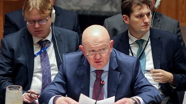 Russia's Permanent Representative to the UN Vasily Nebenzya (center) at a meeting of the UN Security Council - Sputnik International