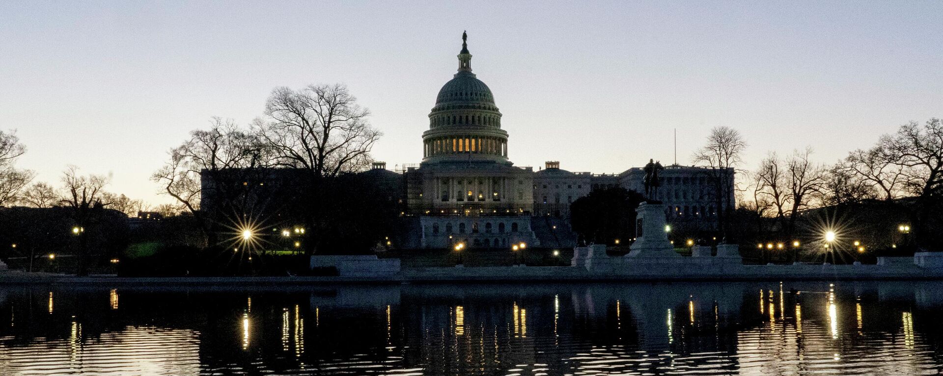 The U.S. Capitol building is seen before sunrise on Capitol Hill in Washington, Monday, March. 21, 2022. - Sputnik International, 1920, 04.04.2022