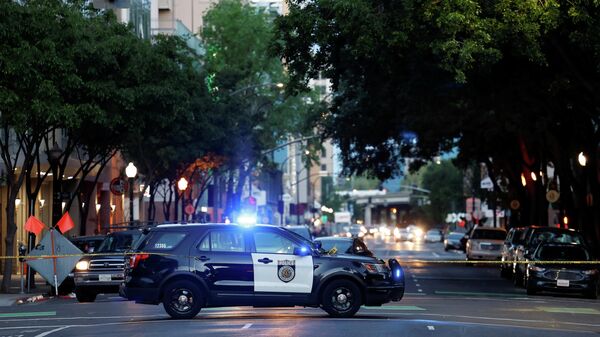 A police vehicle is seen after an early-morning shooting in a stretch of the downtown near the Golden 1 Center arena in Sacramento, California, U.S. April 3, 2022. - Sputnik International