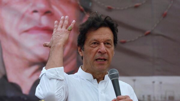 FILE PHOTO: Imran Khan, chairman of the Pakistan Tehreek-e-Insaf (PTI), gestures while addressing his supporters during a campaign meeting ahead of general elections in Karachi, Pakistan, July 4, 2018.  - Sputnik International
