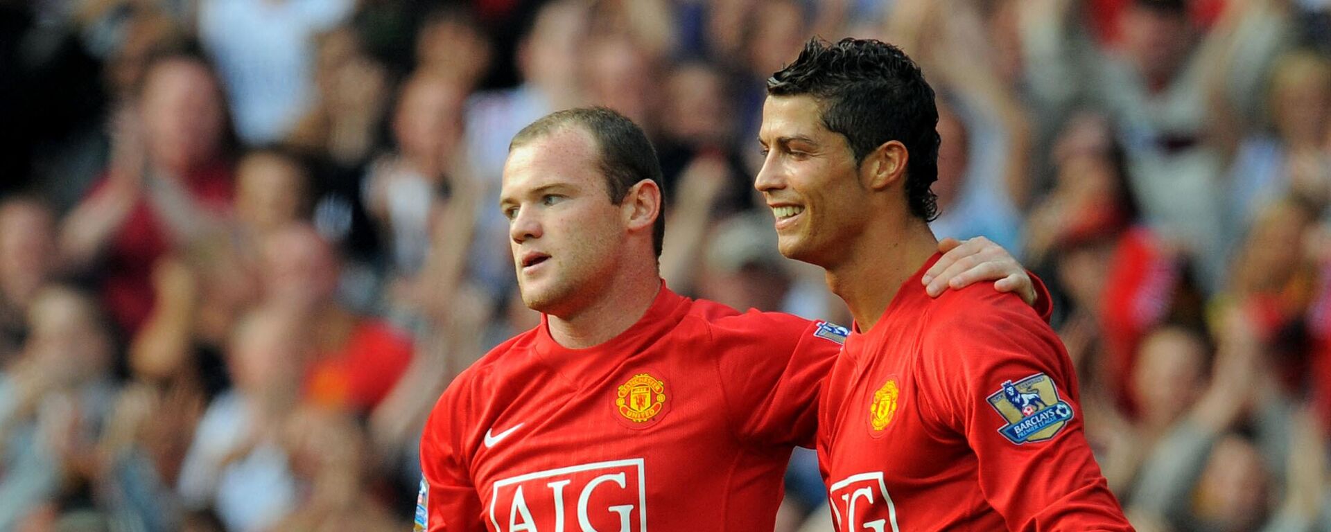 FILE PHOTO: Manchester United's English forward Wayne Rooney (L) celebrates after scoring with Manchester United's Portugese midfielder Cristiano Ronaldo during the English Premier league football match against Bolton Wanderers at Old Trafford, Manchester, northwest England, on September 27 2008.  - Sputnik International, 1920, 08.04.2022