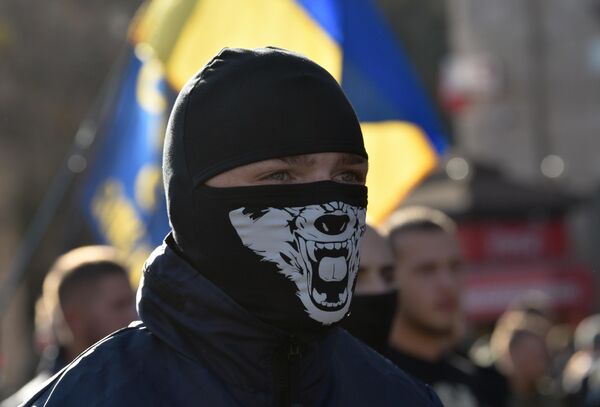 2019: Kiev. Participant of a march dedicated to Ukraine Defender Day.‘Ultras’ – notorious football hooligans with ultranationalist tendencies, as well as young people from underprivileged families, often serve as the backbone of Ukraine’s neo-Nazi organizations. - Sputnik International