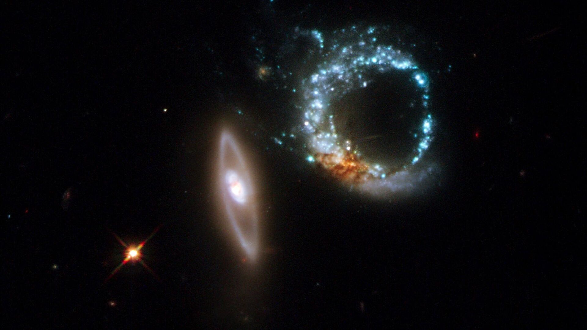 An image taken by Hubble Space telescope and released on October 30, 2008 by European Space Agency (ESA), shows a pair of gravitationally interacting galaxies called Arp 147, photographed on October 27-28, 2008. Arp 147 lies in the constellation of Cetus, more than 400 million light-years away from Earth. - Sputnik International, 1920, 09.04.2022