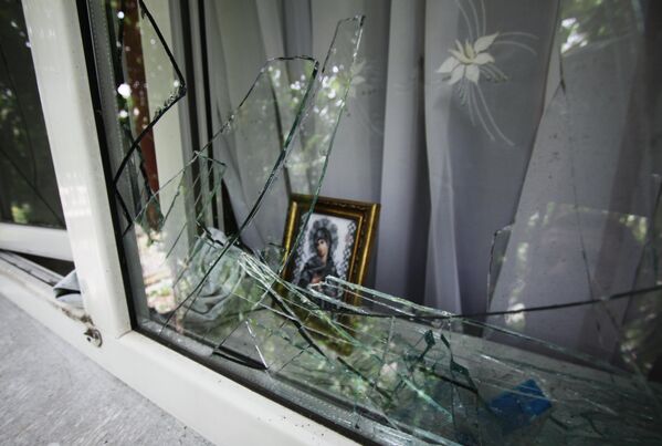 September 2019: Shattered window in a home in the village of Oktyabr, DPR. On the night of 23 September, the village was subjected to an artillery attack.These photos are just a small part of an array of photographic evidence of the systematic destruction of the cities and villages of Donbass over the course of nearly eight years. - Sputnik International