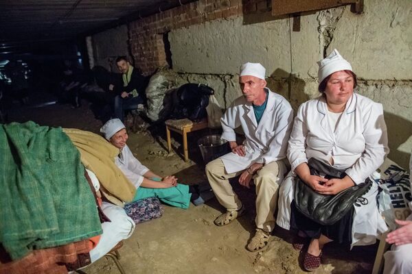 During periods of particularly heavy artillery attacks, doctors, nurses and orderlies would carry patients into hospitals’ basements. From there, the necessary medical procedures would continue to be performed.Above: Medical workers in the hospital in the village of Semyonovka, DPR take shelter in the building’s basement during an artillery strike. - Sputnik International